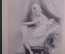 Старинная открытка "Приготовление ко сну. Девушка в пеньюаре". Подписанная. Начало XX века. Европа.
