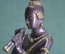 Статуэтка "Монах, играющий на духовом инструменте". Тяжелый металл, патинирование, золочение. Азия.