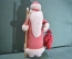 Дед Мороз ватный. В красной шубе, с палкой. Пластиковое основание. Высота 34,5 см.