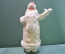 Дед Мороз ватный. В белой шубе, с поднятой рукой. Пластиковое основание. Высота 34,5 см.