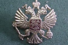 Кокарда. Двуглавый орел, герб Москвы. 