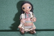 Кукла, куколка в национальной одежде. Девушка с косами.