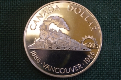 Монета 1 доллар 1986 год. Ванкувер 100 лет, Vancouver. Паровоз. Серебро. Елизавета II. Canada Канада