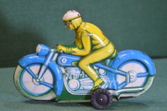 Игрушка жестяная инерционная "Мотоцикл мотоциклист". Металл.  PN Cord. Германия. 1960е.